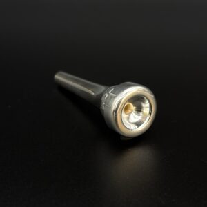 Used 0.673" L-14A4L trumpet mouthpiece in standard weight blank. Good condition.